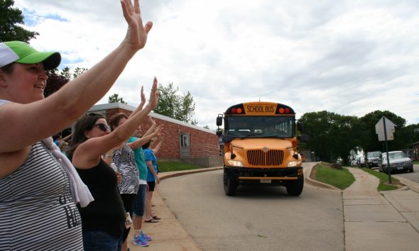 News teachers and staff wave good bye to students