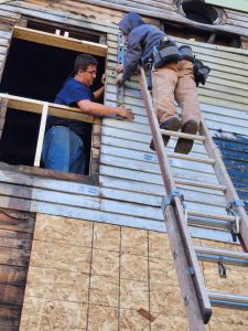 HEART students working on house renovation.