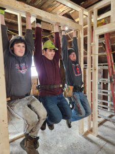 HEART students testing out a header they built.