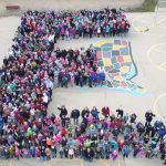 Students and staff form a giant E on the Eisenhower playground.